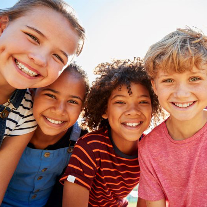 Smiling group of preteen friends