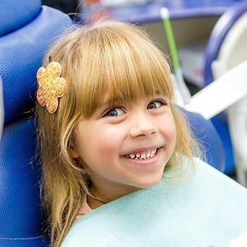 Smiling child in dental chair