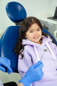 Happy little girl in dentist’s chair