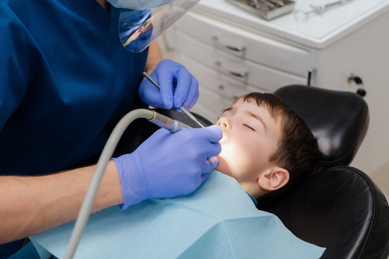 child undergoing pulp treatment