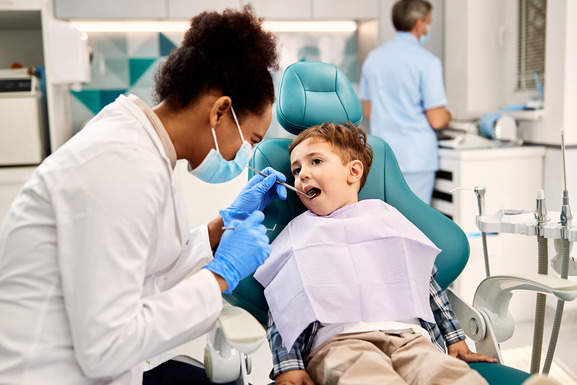 child visiting dentist for checkup 